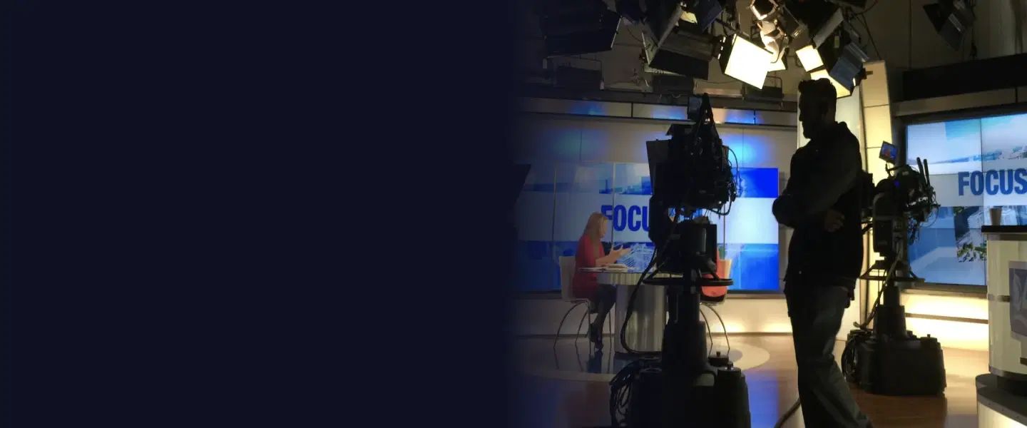 Corporate press conference with media cameras, podium staging, and journalist coverage