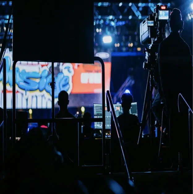 Media press briefing with journalist seating, broadcast cameras, and executive statement setup