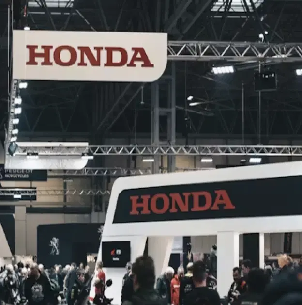 Convention expo floor with exhibitor showcases, sponsor activations, and organized exhibition layouts