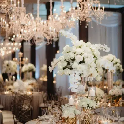 A beautifully decorated event space in Los Angeles with elegant floral arrangements and ambient lighting