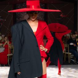 fashion show of a girl in a red and black outfit