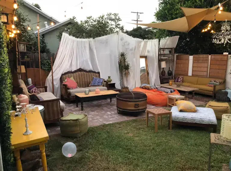Backyard event with rentals, lighting, catering access, seating, and weather planning