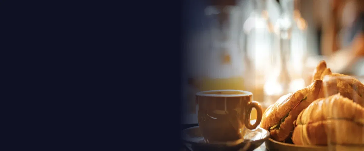 Professional executive breakfast event with business discussion, networking, and organized morning presentation setup