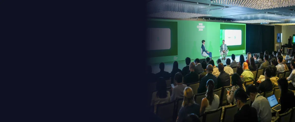 Business conference event with organized seating, speaker presentations, and attendee coordination