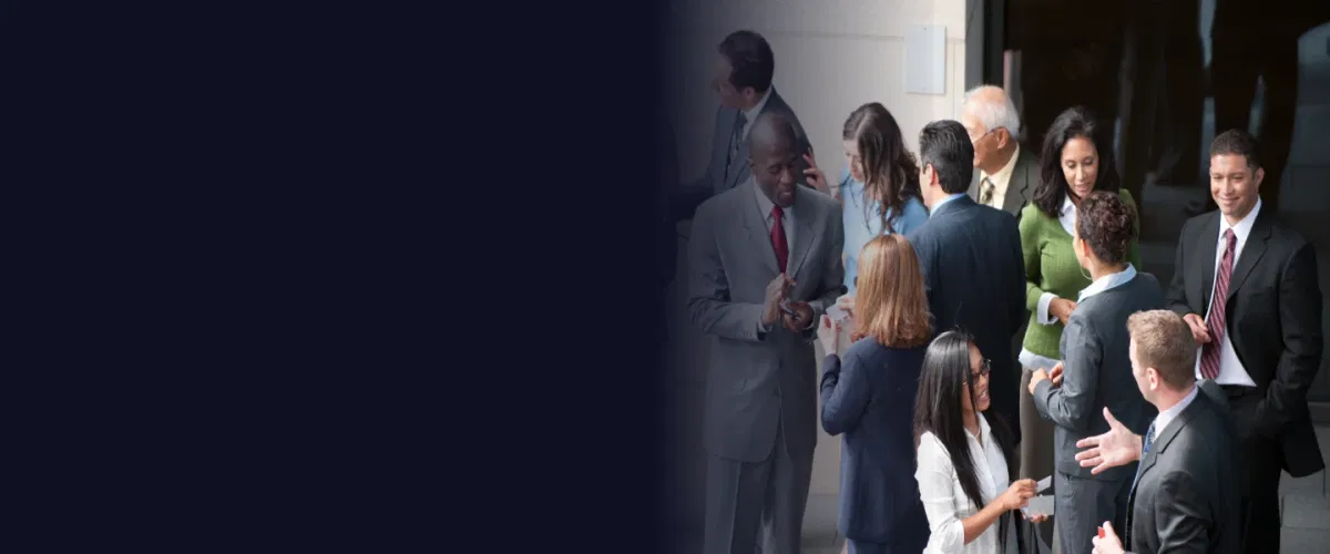 Professional networking reception with relaxed business conversations and executive social atmosphere