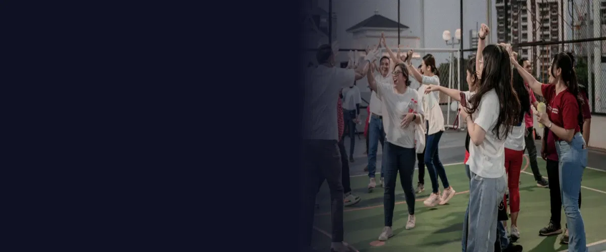 Team building activity with employees participating in collaborative group experiences outdoors